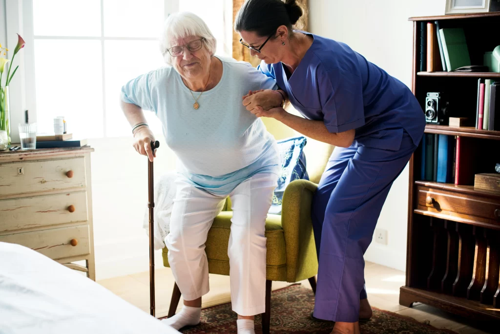 lady being assisted by a nurse