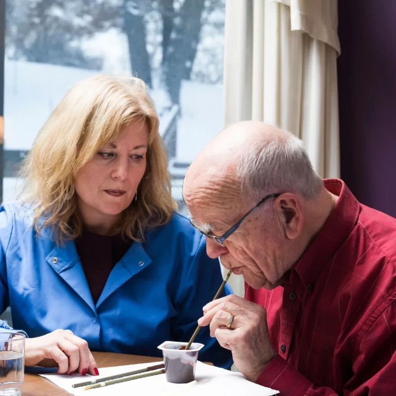 woman helping a man eat