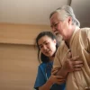 man being assisted in a nursing home
