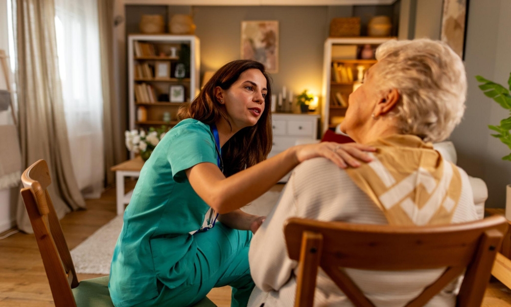 Skilled nurse providing home health care services during a patient home visit