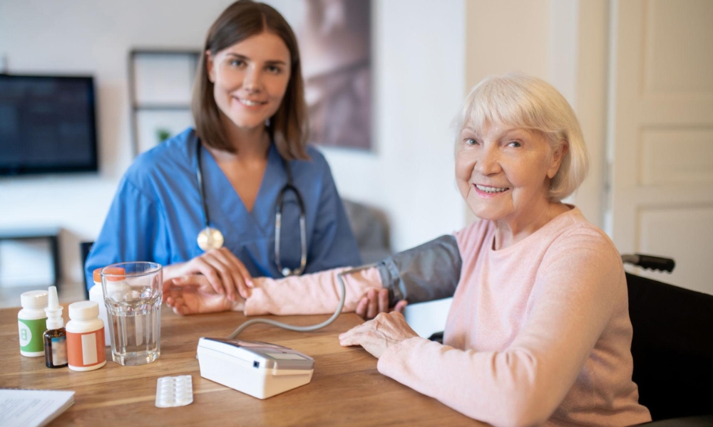 Skilled nurse providing heart failure monitoring and cardiopulmonary care to patient at home
