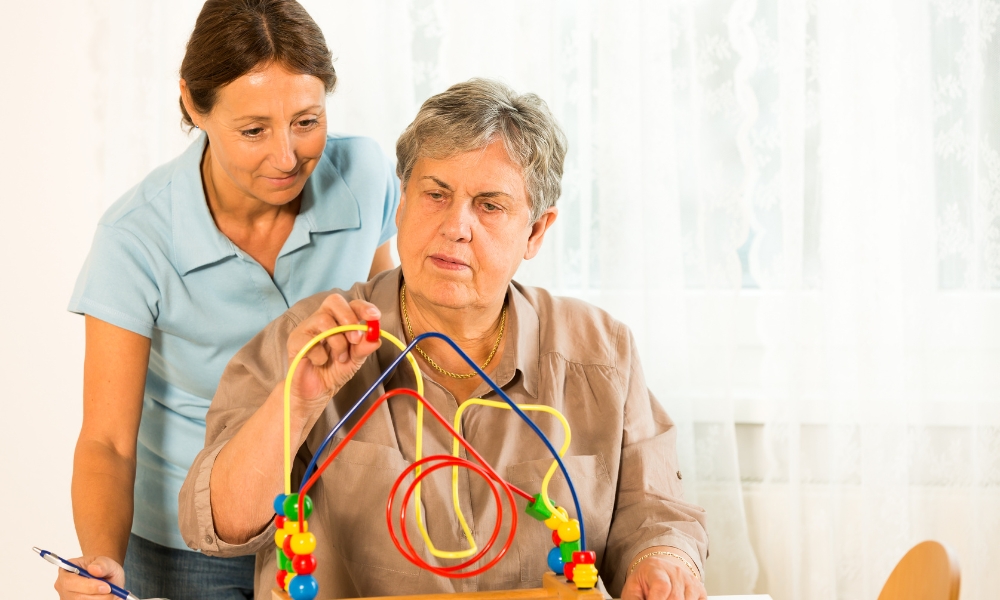 Occupational therapist providing rehabilitation services to patient at home