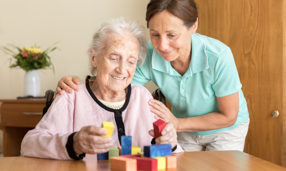 Healthcare professional assessing elderly parent needs during home health care visit