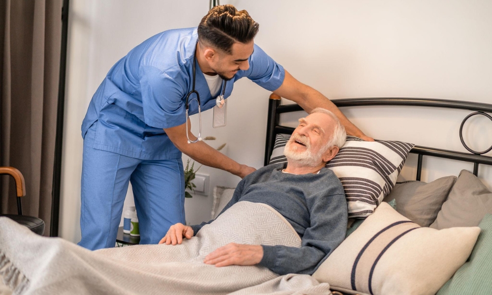 Physical therapist helping an older adult recover mobility at home